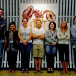 The Arilab team, posing in front of one of the posters.